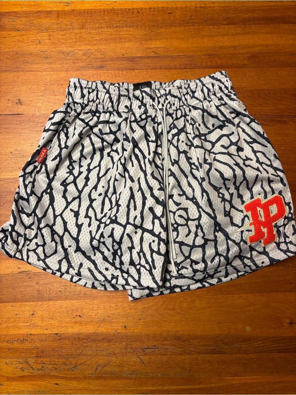 Inaka Power Black & White Patterned Men’s Athletic Shorts with Red Patch